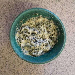 This hot spinach dip, made in a slow cooker, is easy to whip up and definitely a crowd pleaser!