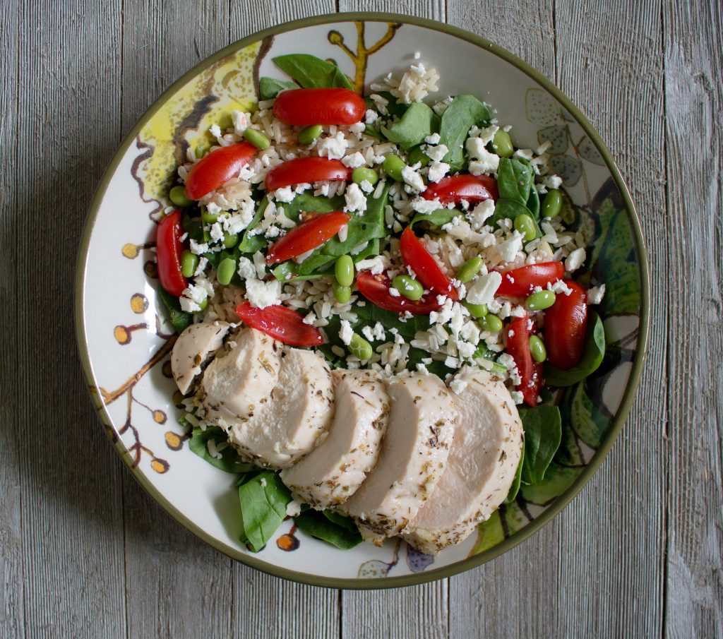 Greek chicken bowls make for a delicious & easy lunch. Whip up a batch on Sunday for lunch all week!