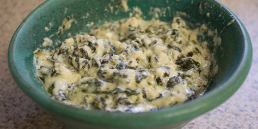 This hot spinach dip, made in a slow cooker, is easy to whip up and definitely a crowd pleaser!