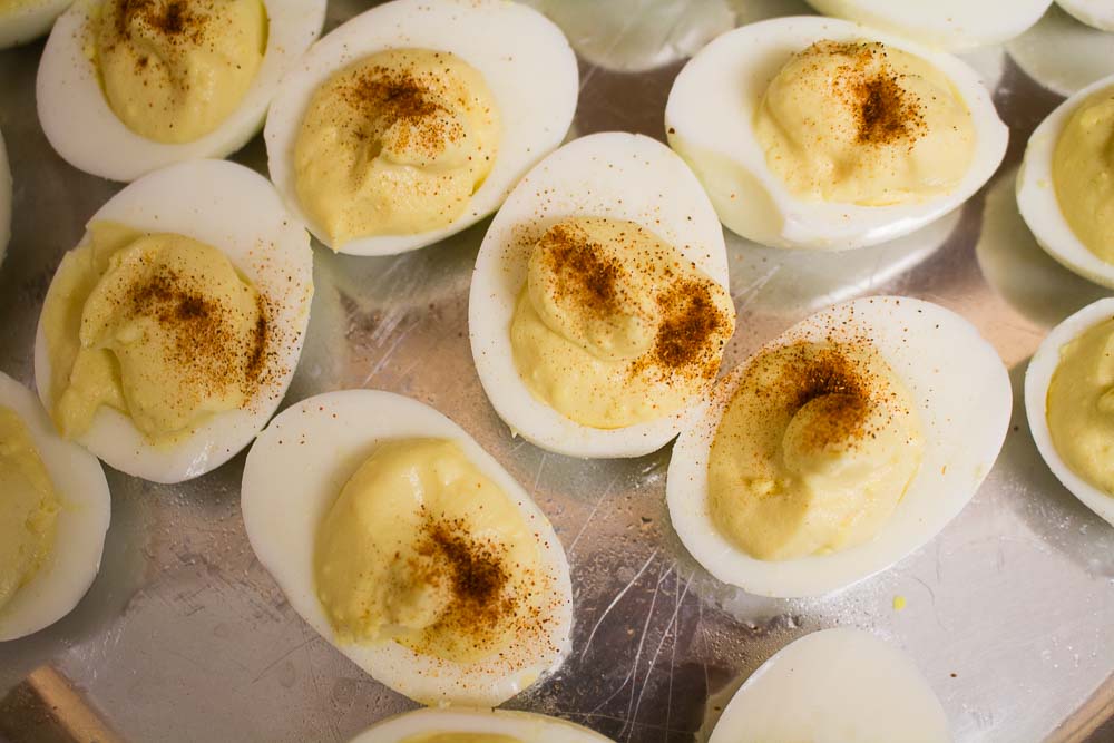 Making deviled eggs is super easy, and a great addition to any picnic or cookout! | Teaspoon of Nose