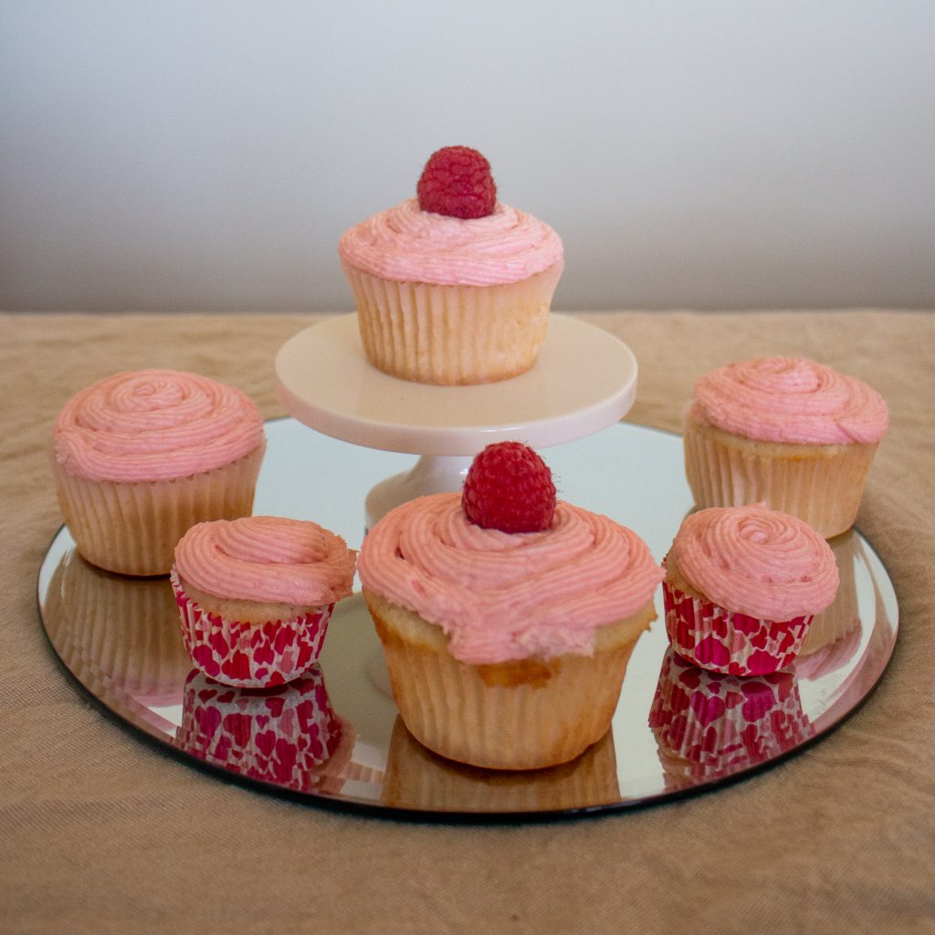Raspberry Champagne cupcakes are light and fluffy, with champagne in both cupcakes and frosting and a zing of fresh raspberries to top it off! Bet you can't eat just one...