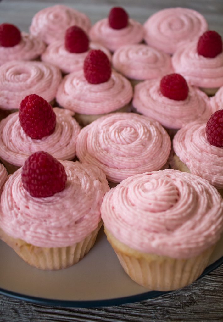 Raspberry Champagne cupcakes are light and fluffy, with champagne in both cupcakes and frosting and a zing of fresh raspberries to top it off! Bet you can't eat just one...