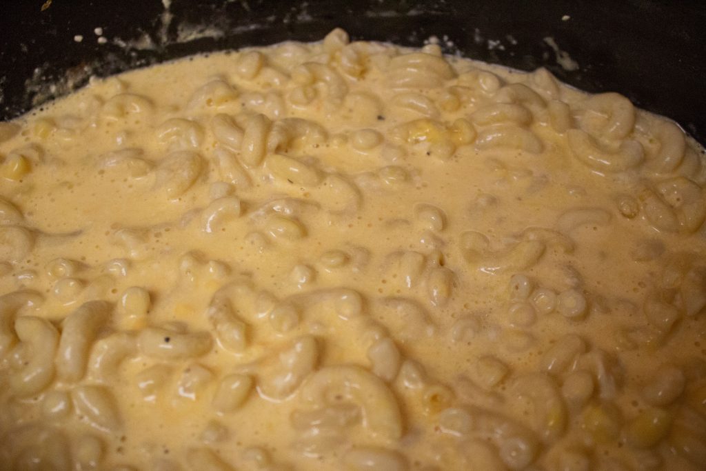 Slow cooker macaroni and cheese is the best thing you can bring to a party or potluck!