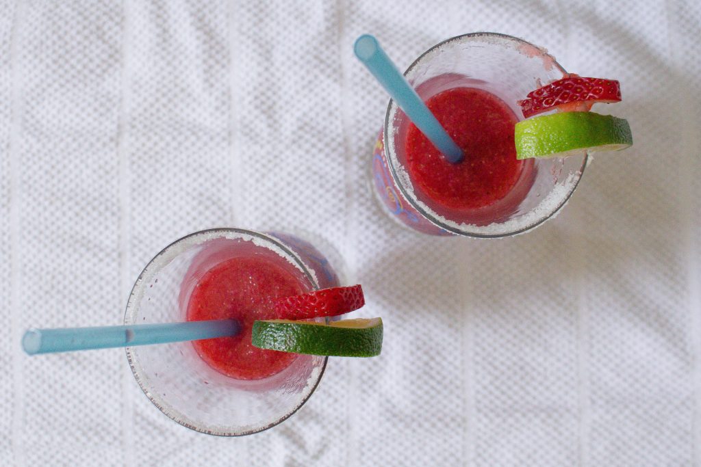 Frozen strawberry margaritas make for the perfect little pick me up on a hot day. Want to sit outside with a book? Got a friend coming over last minute? Headed for a day at the lake/pool/beach? These are just what you need.