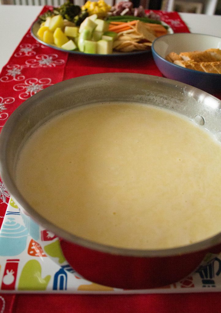Cheese fondue is the perfect addition to your New Year's Eve party! It makes any gathering feel like a party, and this classic version is effortless to whip up!