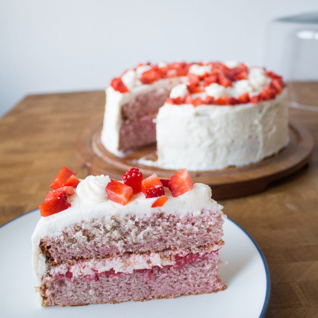 Strawberry cake with prosecco frosting is light and fluffy, just the right amount of sweet, and the perfect sweet bite of spring!