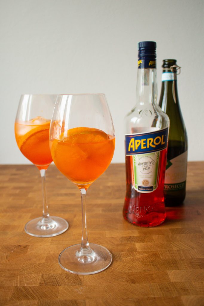 Aperol Spritz is a classic Italian apertivo, and they're so easy to make at home! I'm sharing the two different classic versions, and my own favorite aperol spritz recipe! | Teaspoon of Nose