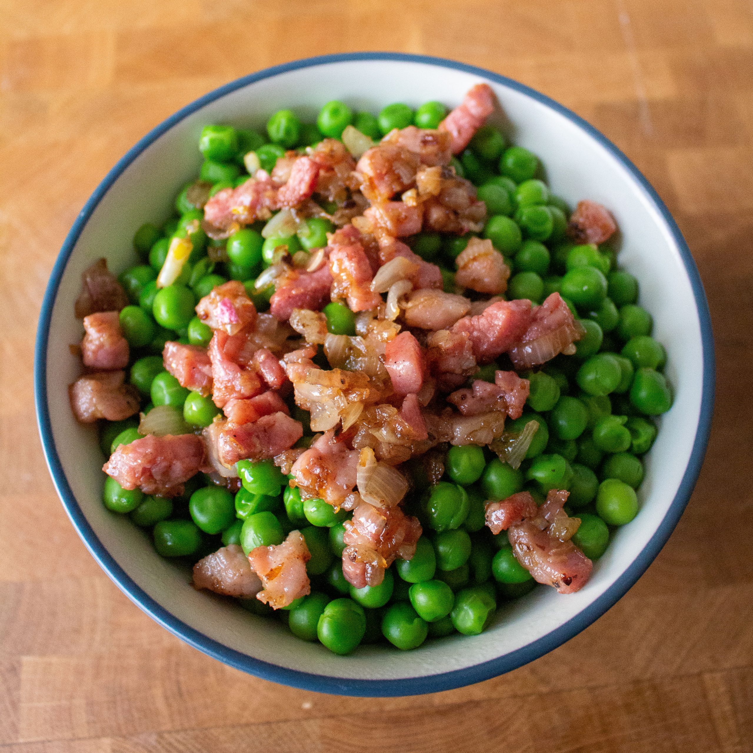 Peas with pancetta is an effortless summer side dish! | Teaspoon of Nose 