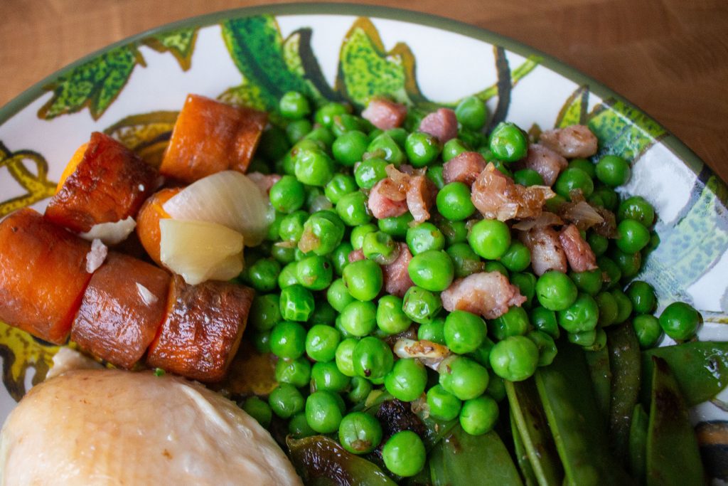 Peas with pancetta are the perfect easy side dish! The pancetta makes them seem elegant, but they're simple enough to toss together in ten minutes!