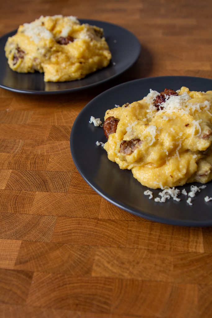 This cheesy sausage polenta is classic northern Italian food. It's also the ultimate comfort food for a weeknight dinner!
