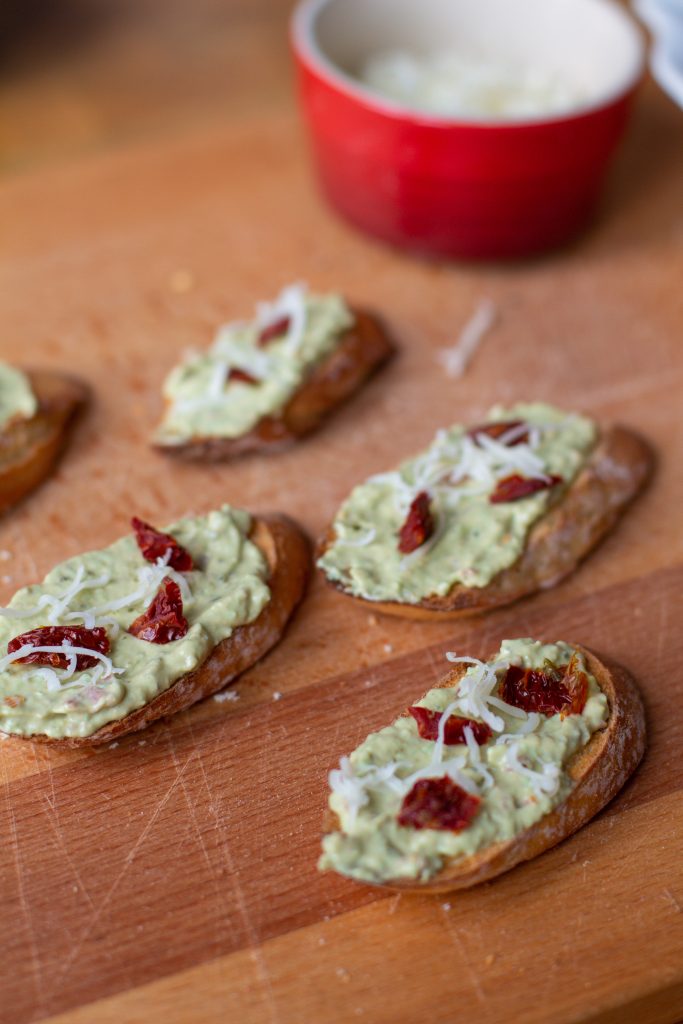 These creamy pesto and tomato crostini will give you the brightness of summer even in the middle of winter!