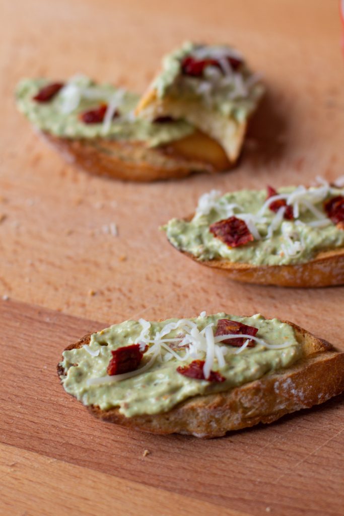 These creamy pesto and tomato crostini will give you the brightness of summer even in the middle of winter!